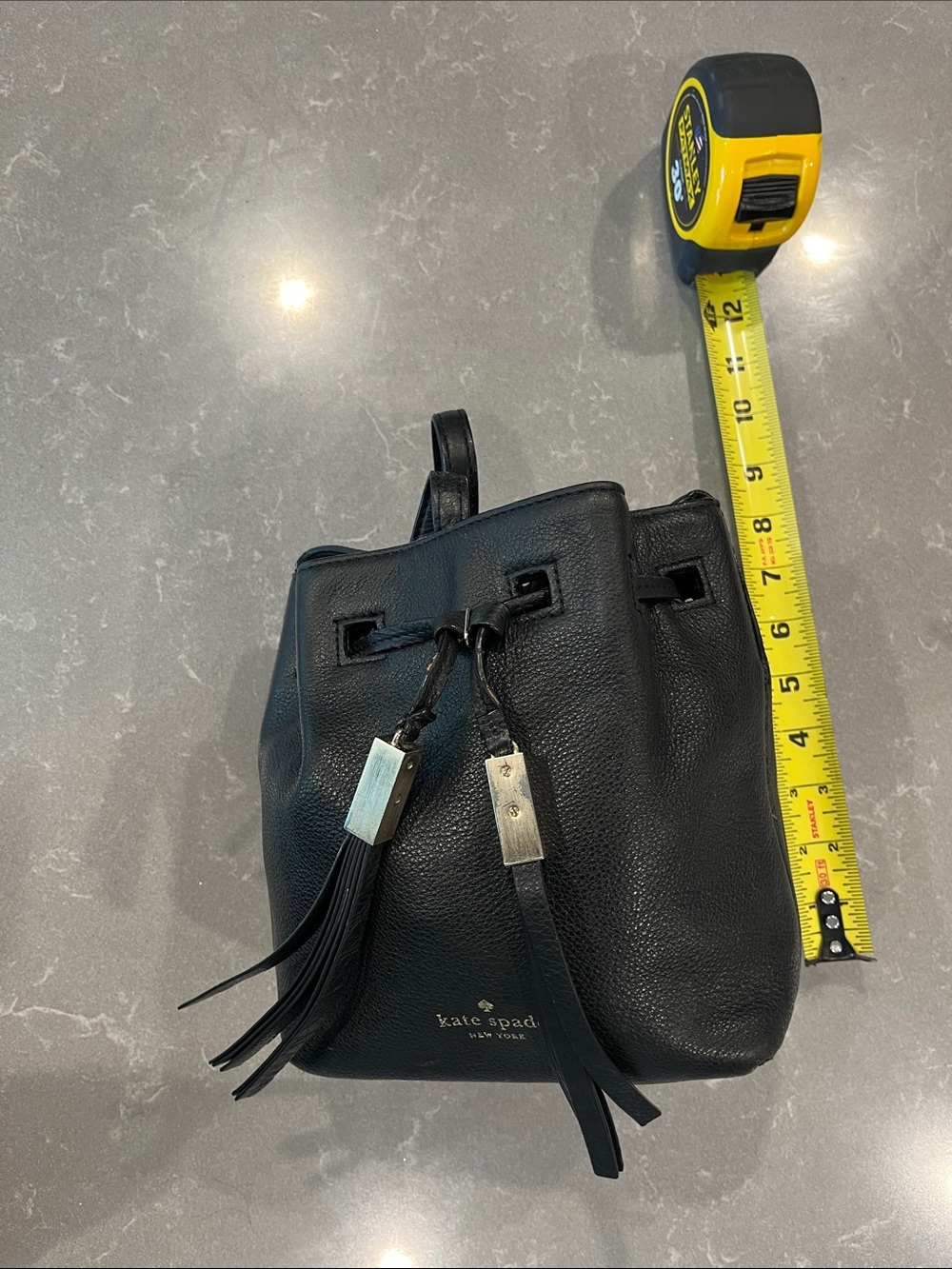 kate spade Black Pebbled Leather Tassel Drawstring Backpack